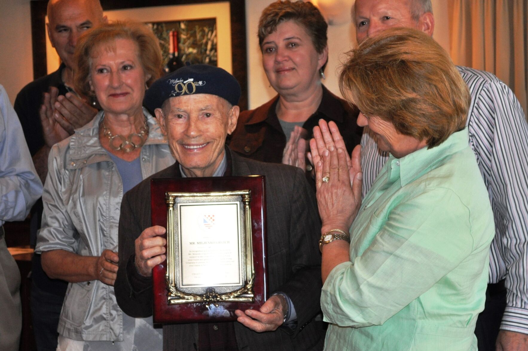 Miljenko "Mike" Grgich receives a plaque from Croatian Scholarship Fund